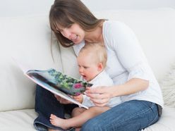 mum reads a story to her baby as part of the baby’s bedtime routine