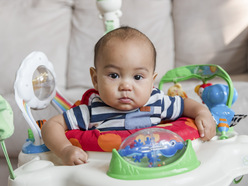 Baby sitting in a baby walker