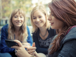 three women talking in a group