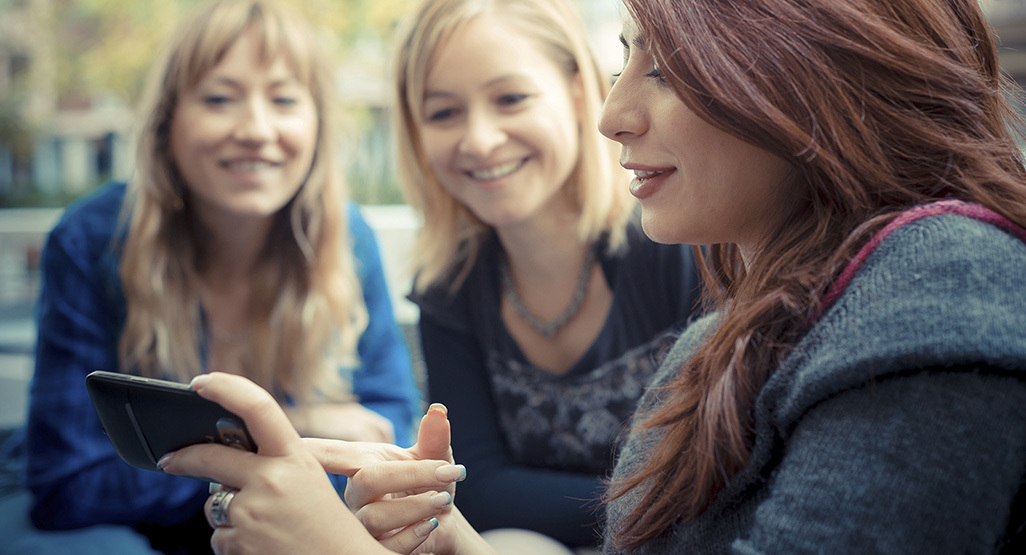 three women talking in a group