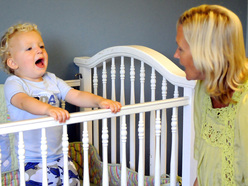 a mum trying to get her toddler to settle down and sleep