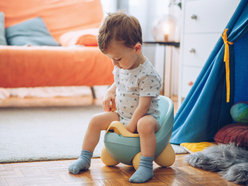 Boy sitting on potty
