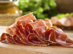 slices of prosciutto on a chopping board
