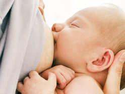 young baby breastfeeding